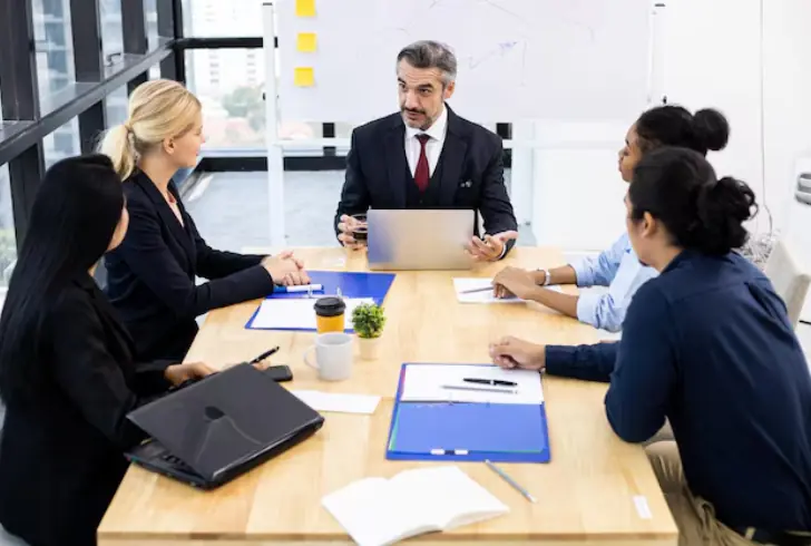 Leader practicing company values with team