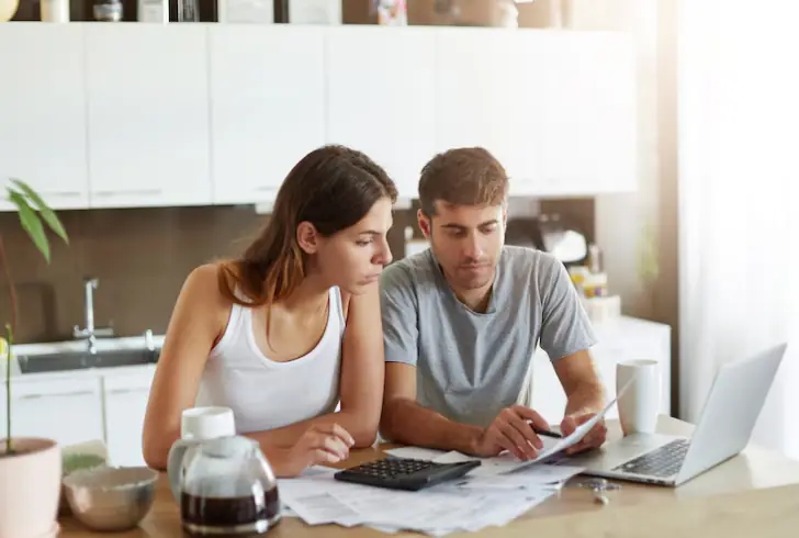 Couple reviewing wedding costs together